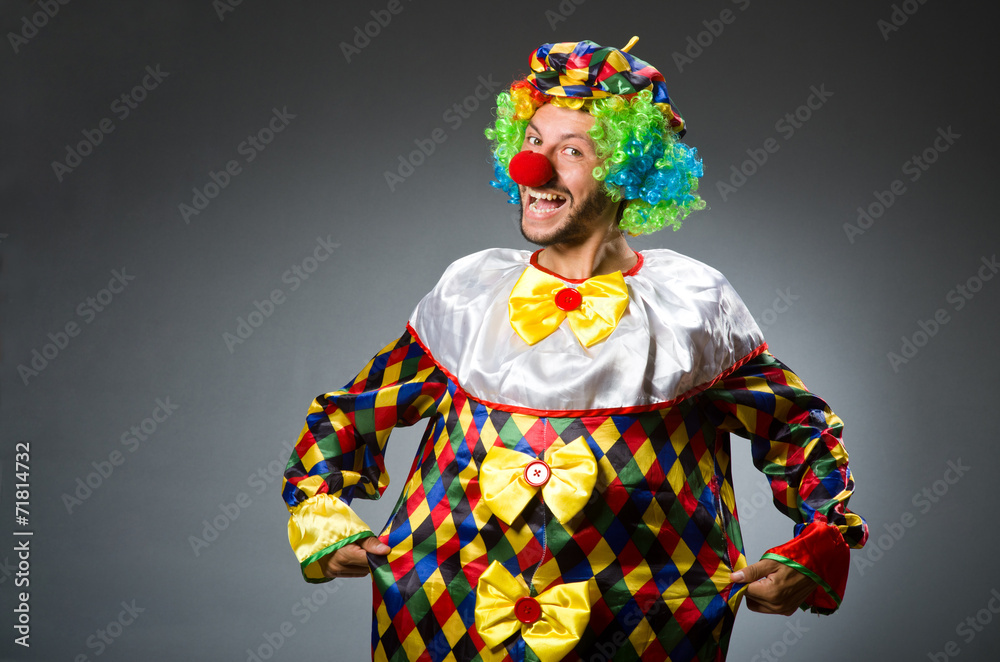 Funny clown in colourful costume