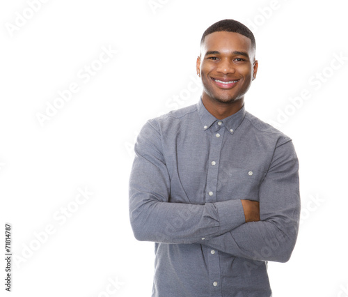 Modern young black man smiling with arms crossed