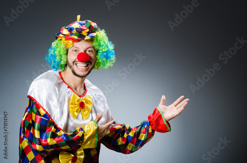 Funny clown in colourful costume