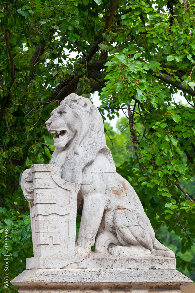 Stone lion with a board  in Budapest
