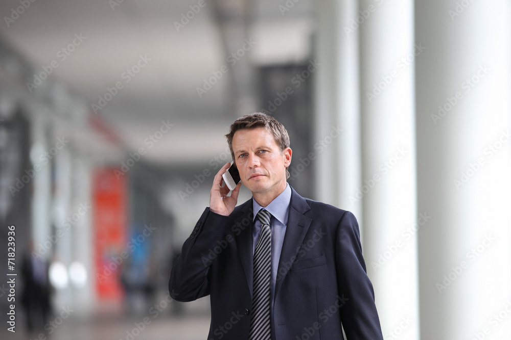 businessman talking on the phone during a business travel businessman talking on the phone during a business travel