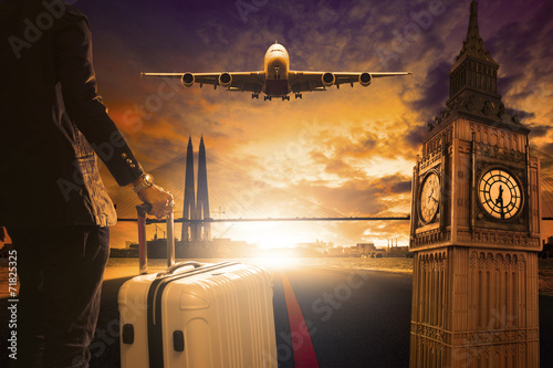 Photography young business man standing with luggage on urban airport runway