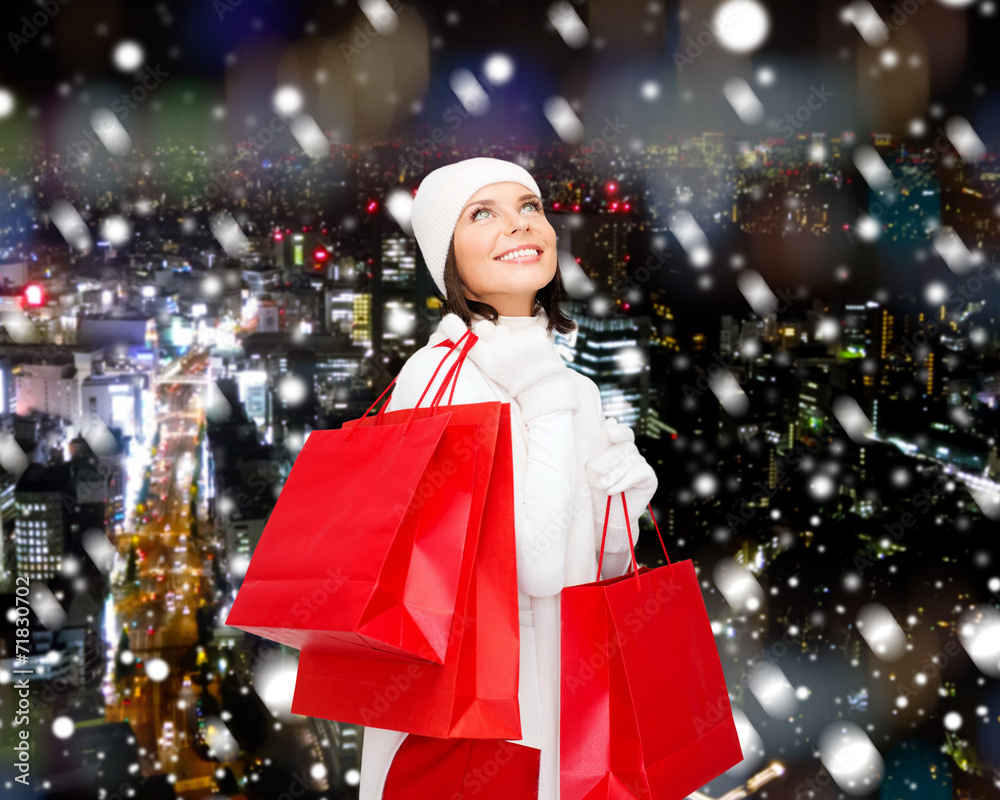 smiling young woman with red shopping bags smiling young woman with red shopping bags
