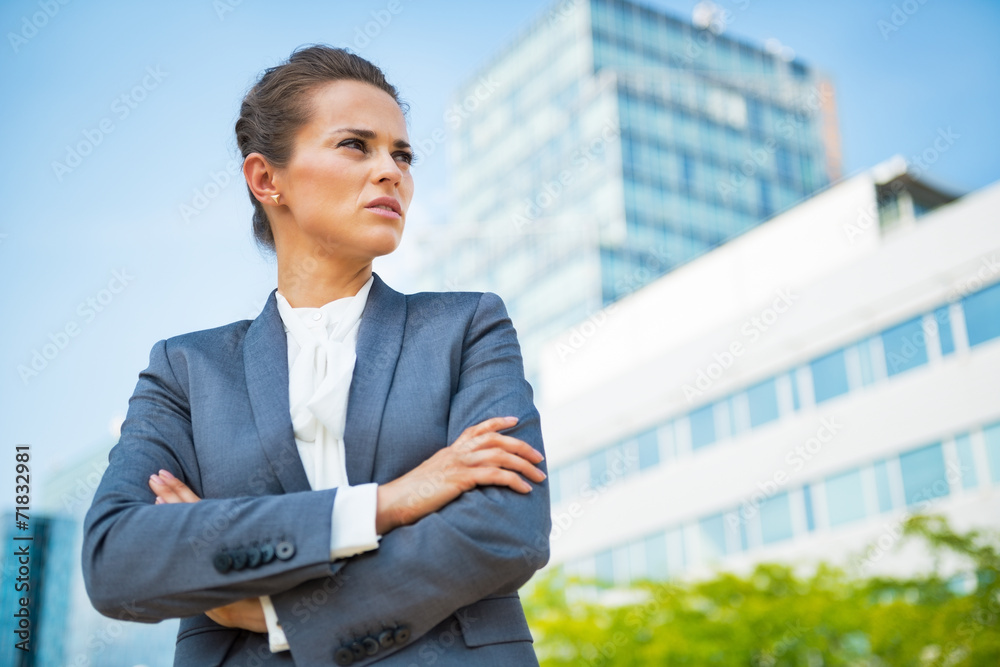 Portrait of confident business woman in front of office building Portrait of confident business woman in front of office building