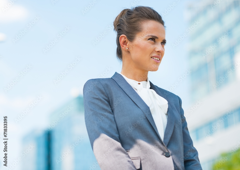 Portrait of happy business woman in office district Portrait of happy business woman in office district