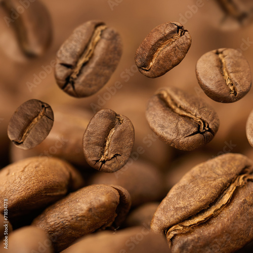 Closeup of coffee beans with focus on one © Natalia Merzlyakova