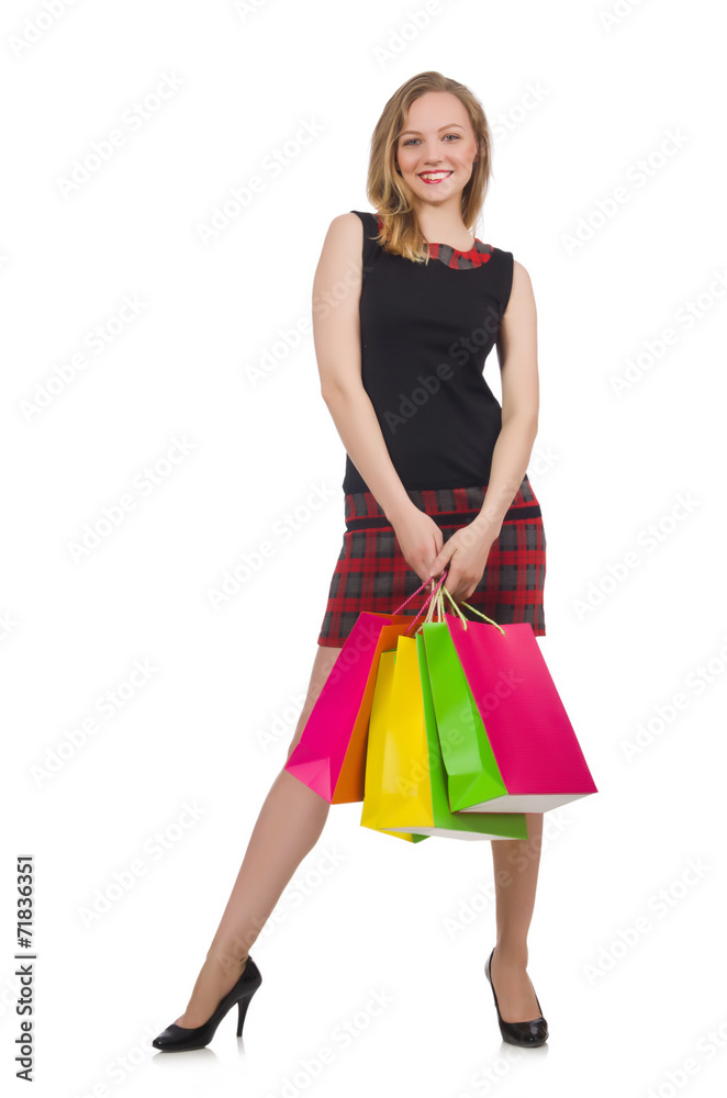 Woman after shopping spree on white