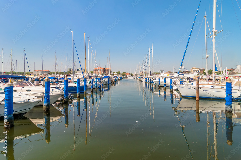 Port of Cervia with boats and yachts on the quay, Italy.