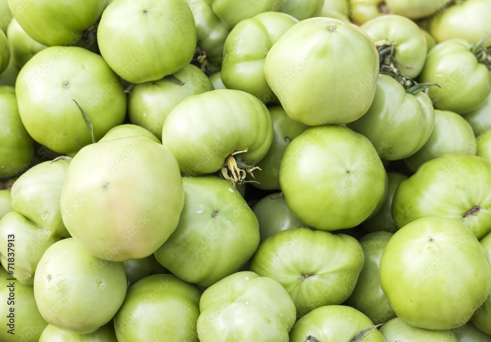 Pickle green tomatoes in a supermarket Pickle green tomatoes in a supermarket