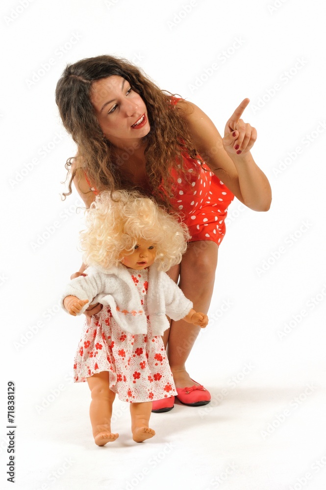 Teenager girl with belonde baby doll isolated white background Teenager girl with belonde baby doll isolated white background