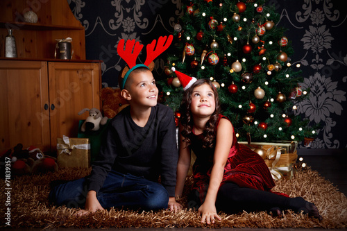 Portrait of cute little kids at Christmas Eve