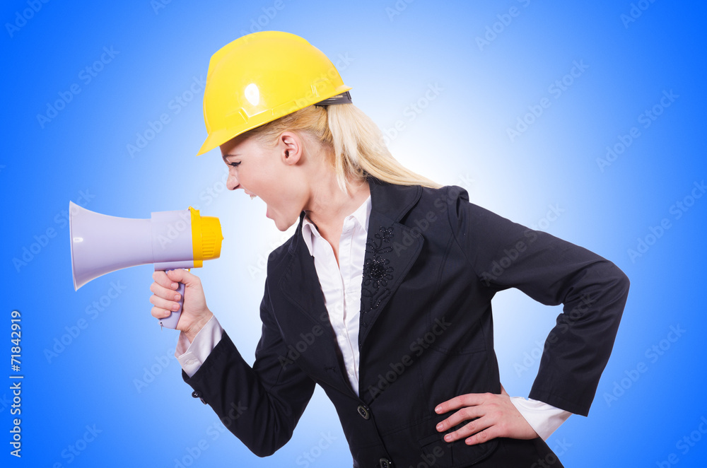 Female construction worker with loudspeaker Female construction worker with loudspeaker