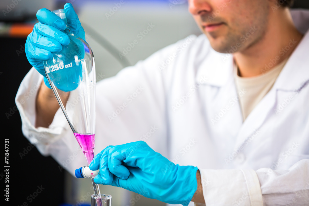 Young male researcher carrying out scientific research in a lab
