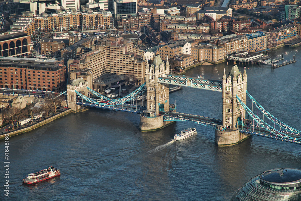 Tower Bridge with boats in London, England