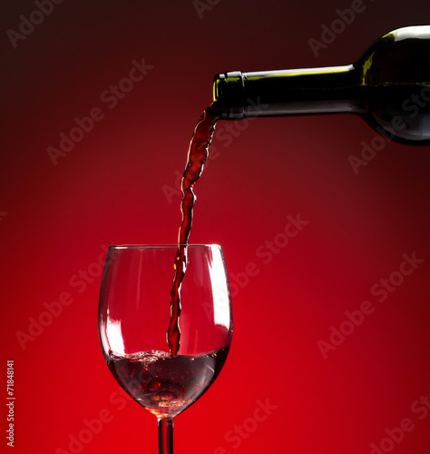 Red wine being poured into wine glass