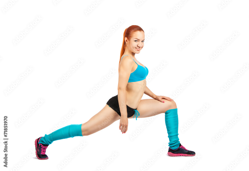 young red-haired girl doing exercises