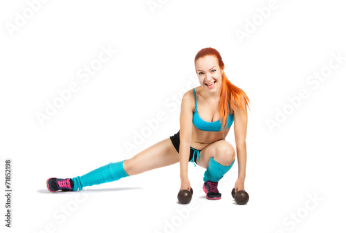 young red-haired girl doing exercises