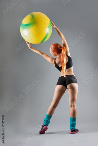 Health and Fitness woman in gym outfit with a Pilates ball © akvafoto2012