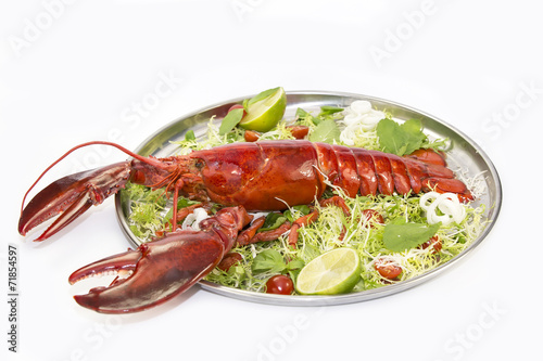 lobster with fresh herbs and lemon on a white background