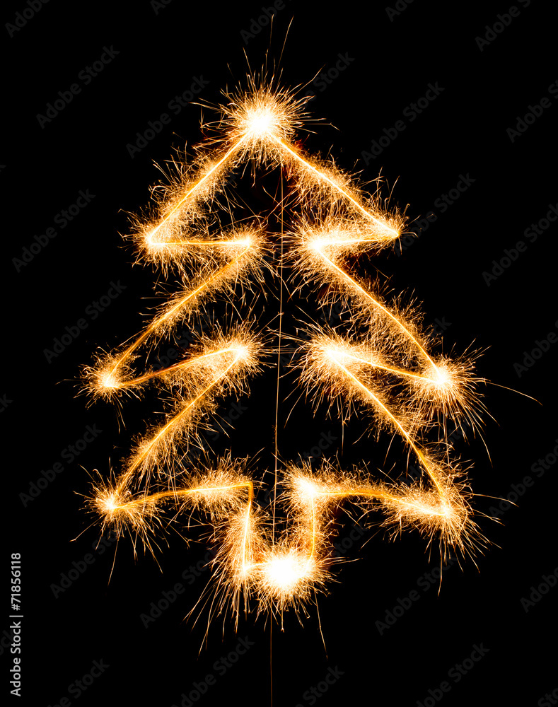 Christmas tree made by sparkler on a black