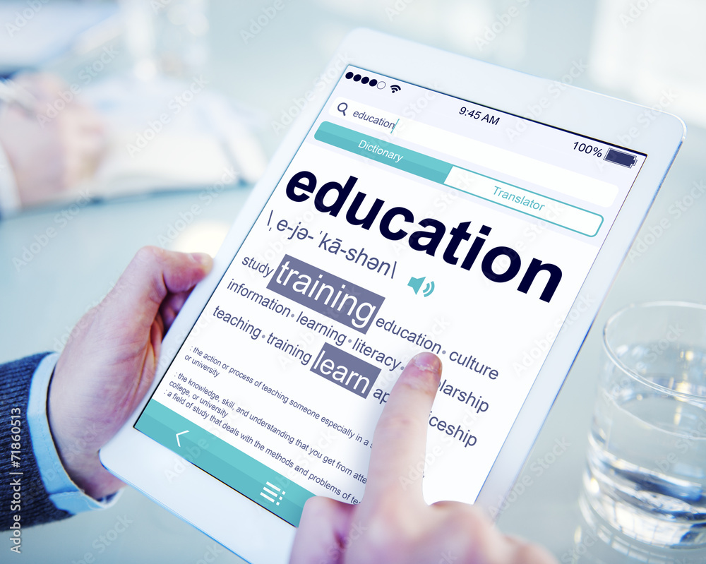 Man Reading the Definition of Education Man Reading the Definition of Education