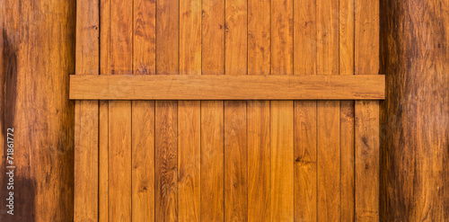 Wooden wall with beam and columns constructed from teak wood