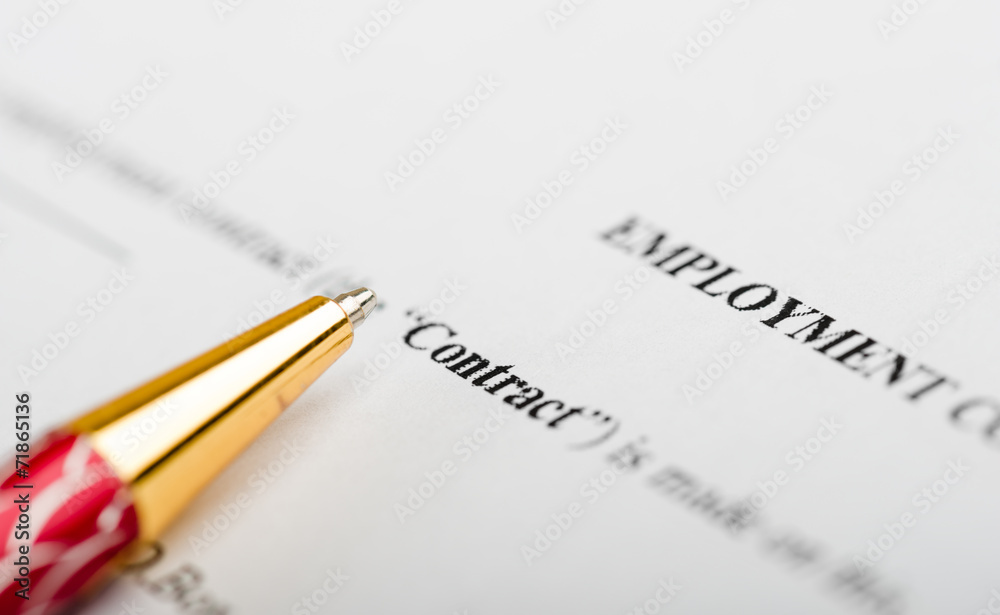 Pen on the contract papers Pen on the contract papers