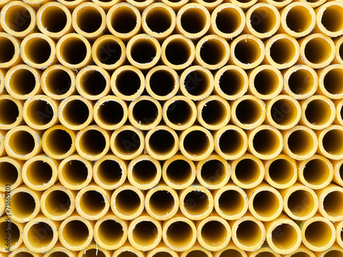 Stack of yellow PVC pipes