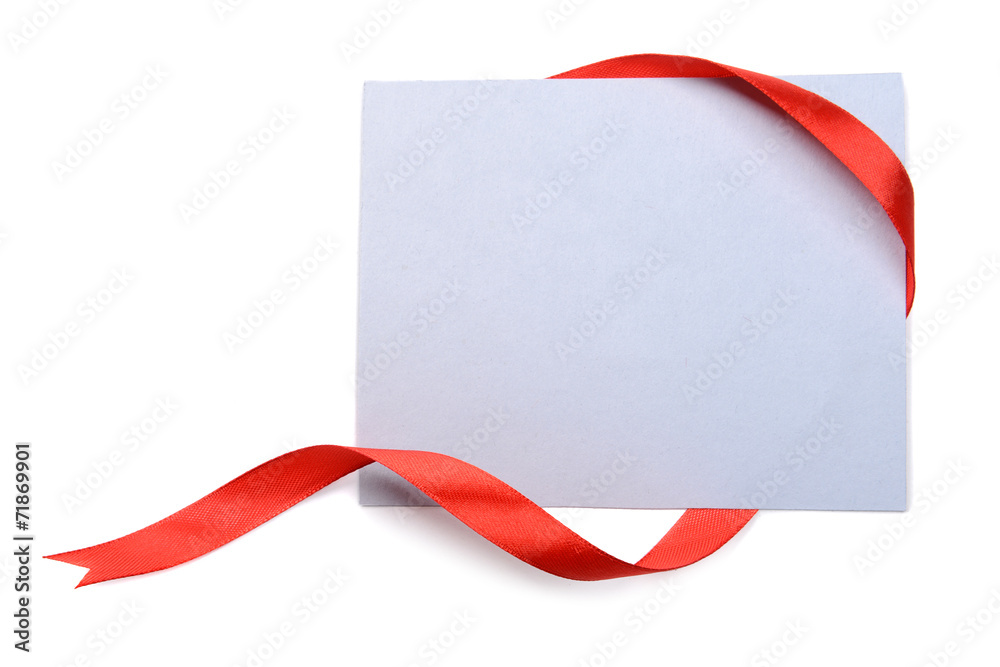 Shiny red ribbon with card isolated on white Shiny red ribbon with card isolated on white