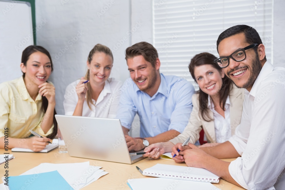 Casual business team having a meeting using laptop Casual business team having a meeting using laptop