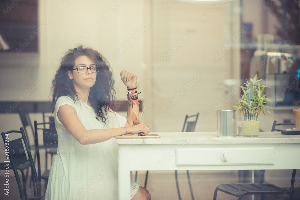 young beautiful moroccan curly woman using tablet young beautiful moroccan curly woman using tablet