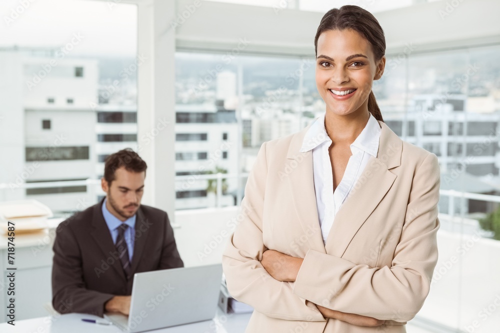 Beautiful businesswoman with arms crossed at office Beautiful businesswoman with arms crossed at office