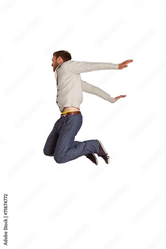 Full length of cheerful young man jumping