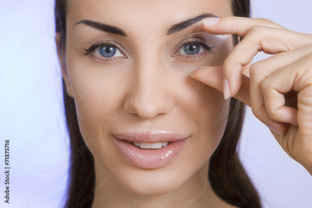 Naklejka premium Optics and Glasses, Portrait of young smiling woman looking thro
