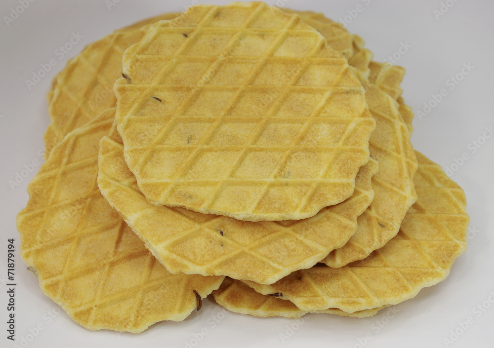 Salted pressed baking with caraway seeds on white background
