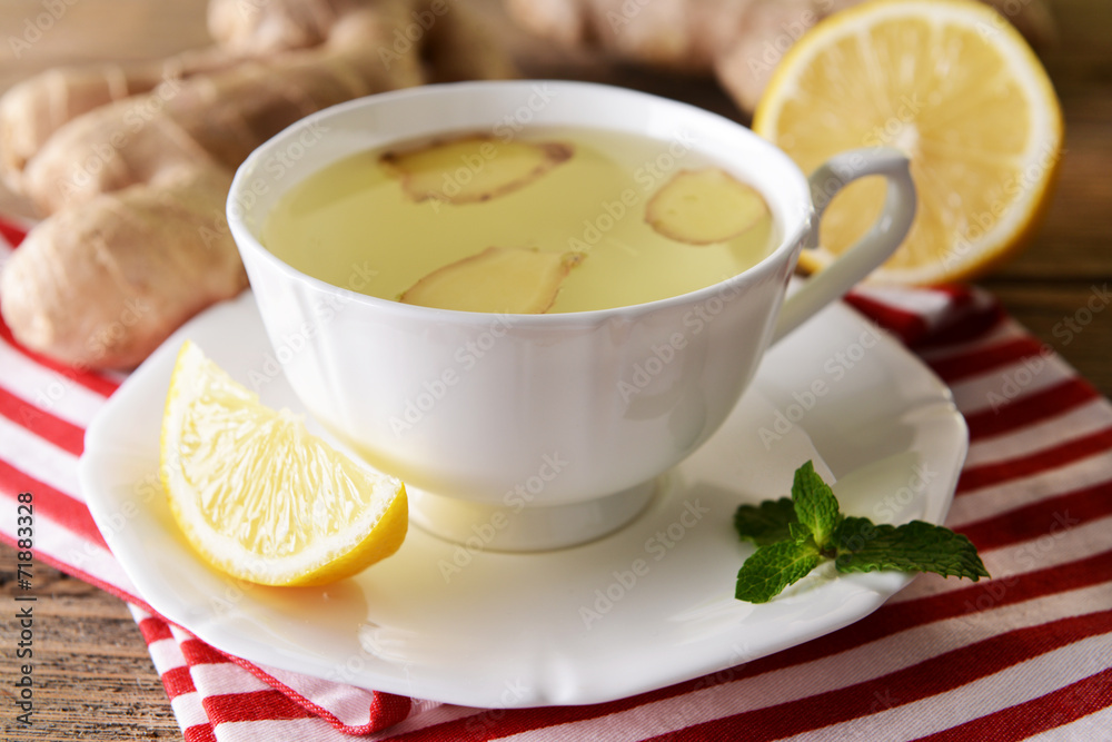 Ginger tea with lemon on table close-up Ginger tea with lemon on table close-up