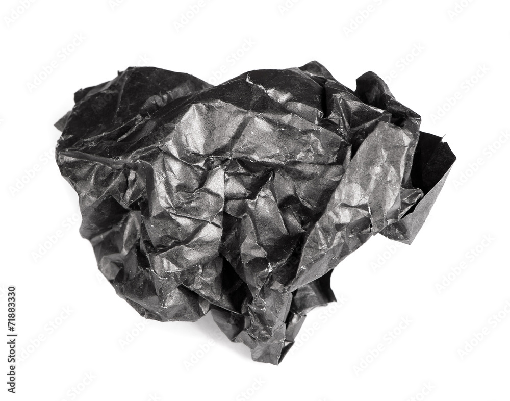 Screwed up piece of black paper Screwed up piece of black paper