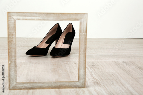 Black women shoes with frame on floor