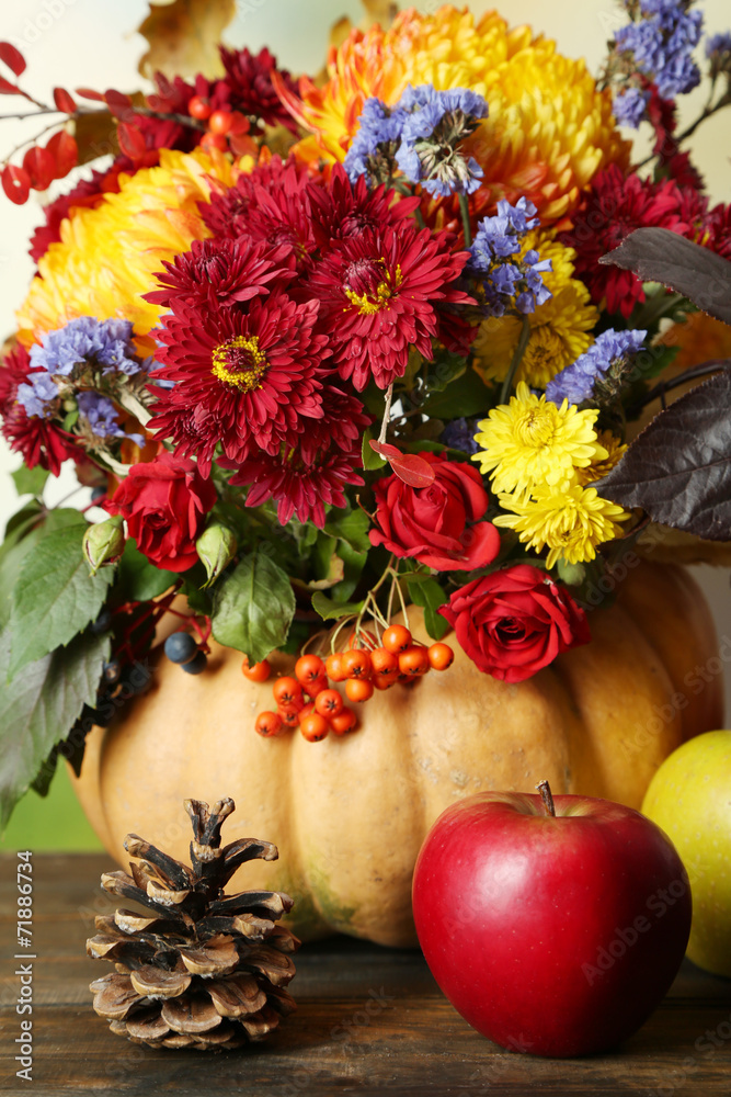 Beautiful autumn composition on table on bright background