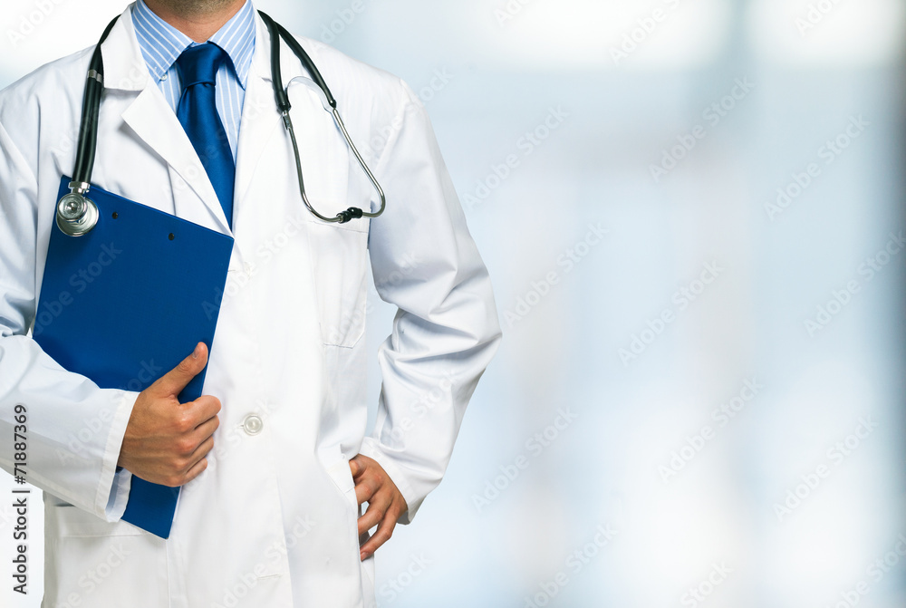 Doctor holding a clipboard Doctor holding a clipboard