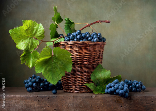 Still life with grapes in a basket