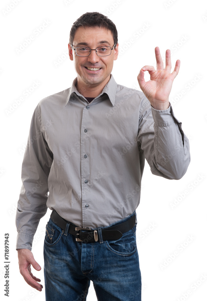 Happy young man gesturing OK sign Happy young man gesturing OK sign
