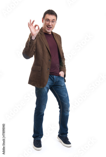 Happy young man gesturing OK sign