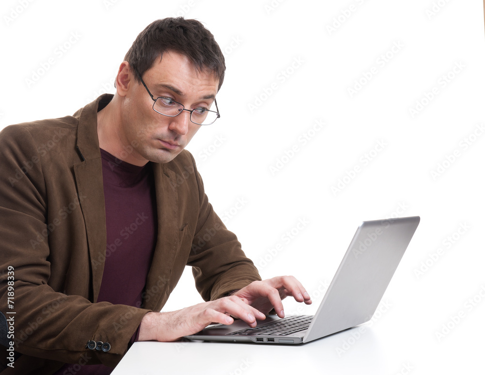 young man working on laptop computer young man working on laptop computer