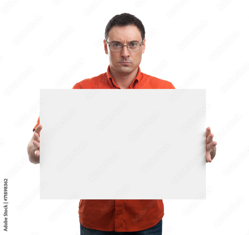 Serious young man showing and displaying placard Serious young man showing and displaying placard