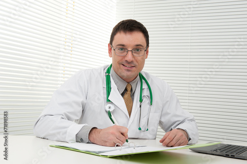 doctor using his laptop computer