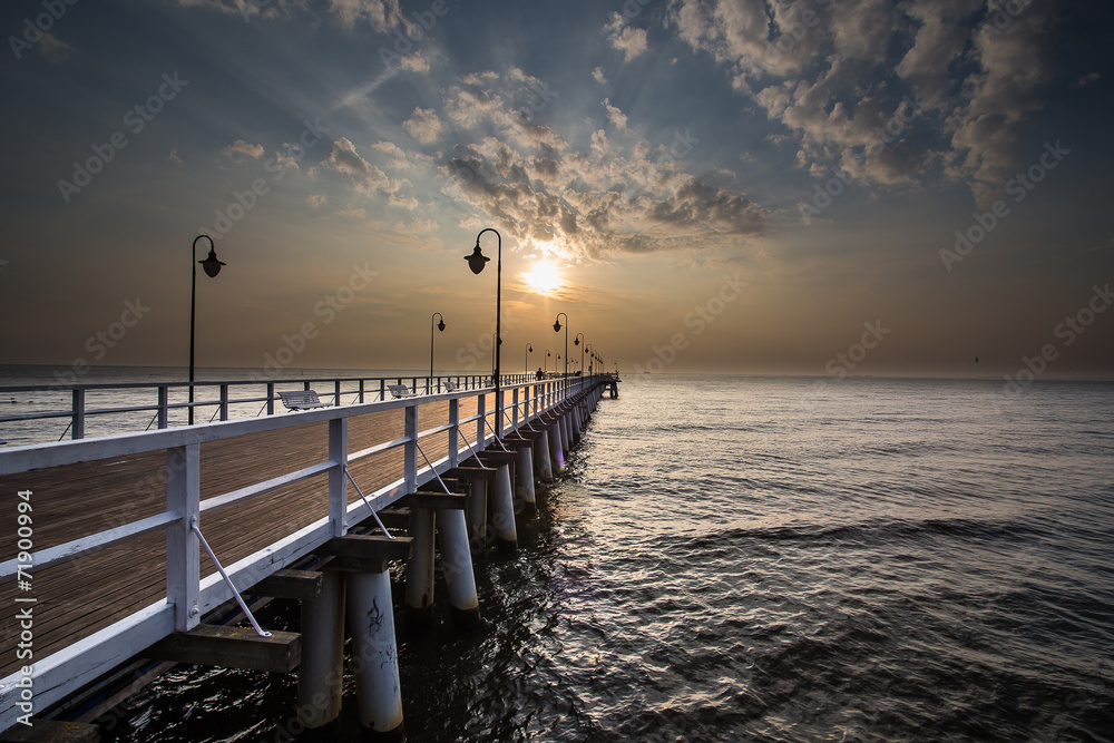 Sunrise on the pier at the seaside, Gdynia Orlowo, 
