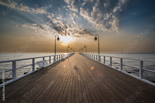 Fototapeta Naklejka Na Ścianę i Meble -  Sunrise on the pier at the seaside, Gdynia Orlowo, 