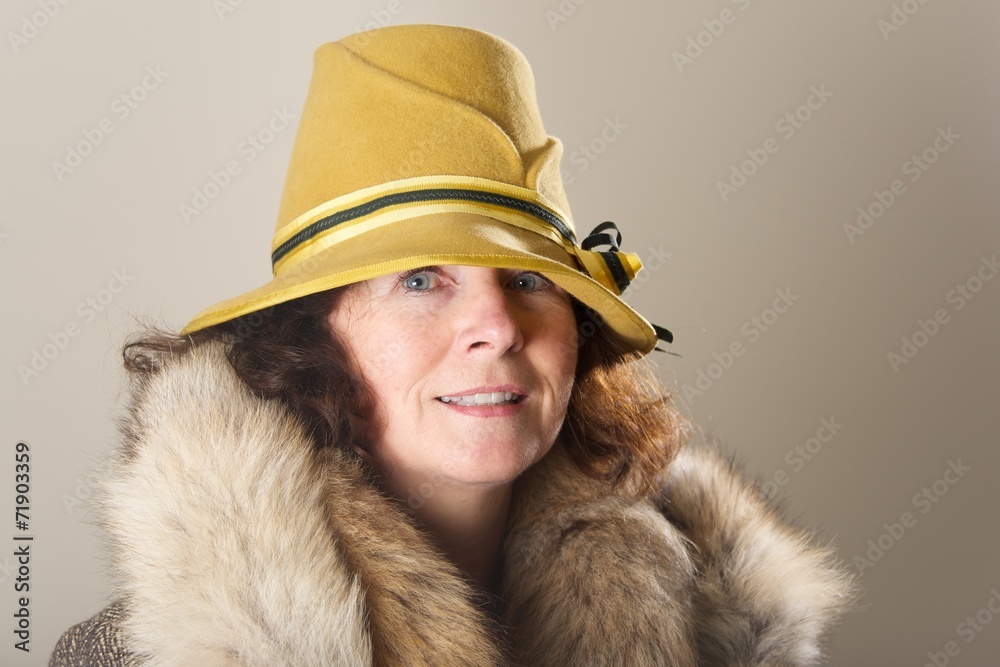 Brunette in yellow felt hat and fur