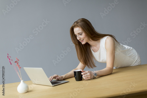 Young woman with laptop in ...